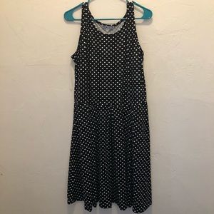 Sleeveless black and white polka dot dress.